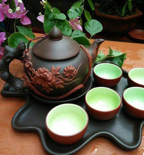 Ấm chén đắp hoa đào nổi
